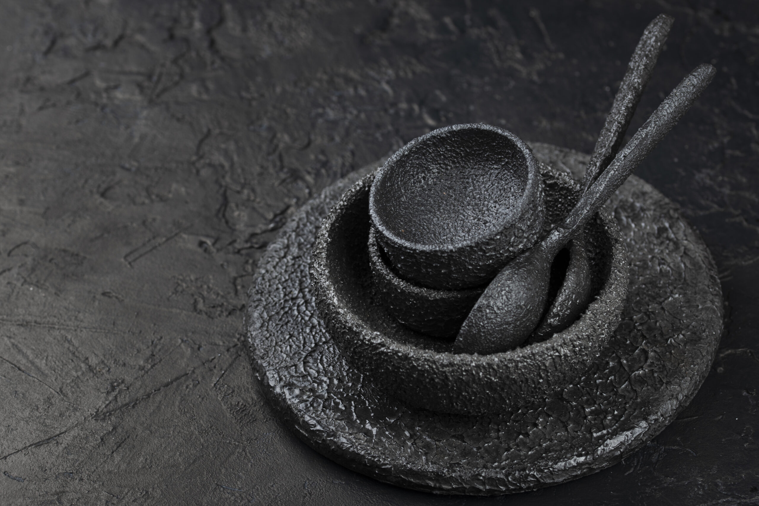 high-angle-black-bowls-spoons-slate